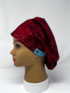 a mannequin head with a red hat on it