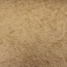 an area rug that looks like it is made out of sheep's wool or fur