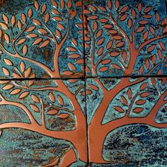 a tree is painted on the side of a building with blue and orange paint,