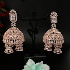 Indian, Pakistani premium, star cut quality traditional jhumkas. Bollywood Style American Diamond Jhumkas With Intricate Design, Heavy American Diamond Jhumkas For Reception, Diwali American Diamond Jhumkas With Cutdana, Bollywood Style American Diamond Jhumkas For Formal Occasions, Traditional Cubic Zirconia Jhumkas For Diwali, Traditional Cubic Zirconia Jhumkas For Festive Occasions, Traditional Festive Cubic Zirconia Jhumkas, Diwali Celebration American Diamond Jhumkas, Heavy Bollywood Jhumkas With American Diamond