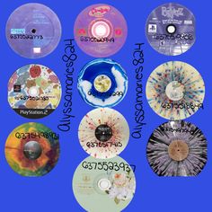 various cd's with different designs and numbers on them