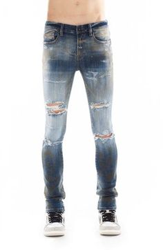 These superskinny jeans are given a punk-rock update with heavy fading, stains and threadbare rips that elevate the lived-in aesthetic. 32" inseam Zip fly with button closure Five-pocket style 92% cotton, 4% polyester, 4% spandex Machine wash, line dry Imported Fitted Distressed Acid Wash Bottoms, Alternative Style Ripped Jeans, Ripped Straight Leg Alternative Jeans, Fitted Distressed Faded Bottoms, Edgy Distressed Jeans For Streetwear, Grunge Distressed Jeans For Alternative Fashion, Urban Style Distressed Fitted Jeans, Edgy Ripped Fitted Jeans, Urban Distressed Fitted Jeans