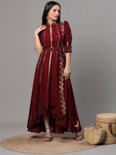 Maroon Georgette Anarkali suit and pants set with golden cutwork. The intricate details and luxurious materials make this ensemble a truly special piece to add to your wardrobe. Every detail has been thoughtfully crafted to elevate your style to the next level. Elegant Floor-length Palazzo Set For Navratri, Elegant Floor-length Kurta With Cutdana, Elegant Floor-length Cutdana Kurta, Elegant Floor-length Kurta For Navratri, Gold Floor-length Palazzo Set For Designer Wear, Gold Dresses With Dabka For Designer Wear, Gold Designer Dress For Navratri, Gold Dabka Dress For Designer Wear, Elegant Gold Dresses For Navratri