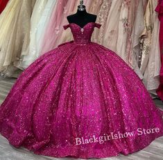 a pink ball gown on display in a store