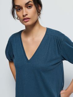 Not your boyfriend's v-neck. Shirred cuffs and front and back yoke give it that relaxed vibe, with a subtle balloon sleeve for a feminine twist. (This one comes in Midnight Navy). | Edie Top in Midnight Navy | Ethical Essentials V-neck Top For Daywear In Fall, V-neck Top For Fall Daywear, Effortless V-neck Top For Daywear, Relaxed Fit V-neck Top For Everyday, Midnight Navy, Shoulder Top, Twist, Blue Color, V Neck