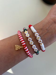 "** 🎄PERSONALIZED CHRISTMAS BRACELETS  This beautiful Christmas collection of stacking bracelets is a perfect gift for the holidays! 🎅🏼 PRODUCT DETAILS: ⭐️ All letters are upper case. ⭐️ Our bracelets are made with stretchy elastic material. ⭐️ Our beads material is Polymer Clay, and each letter bead is made of acrylic. ⭐️ The Christmas Tree charm material is Gold filled, which gives extra durability! ⭐️ Kindly note that -besides the tree charm- the only materials filled with gold are the rou Christmas Polymer Clay Bracelet, Merry Christmas Bracelet, Clay Bead Bracelet Ideas Preppy Christmas, Christmas Bracelets Clay Beads, Grinch Clay Bead Bracelets, Winter Beaded Bracelets, Christmas Bead Bracelet Ideas, Preppy Christmas Bracelets, Holiday Clay Bead Bracelets