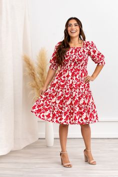 You’ve just secured your new favorite dress! The Elaine Dress is the epitome of beauty, featuring a bold, red floral pattern that makes a statement in any setting. The flattering square neckline and puff sleeves elevate your look, while the form-fitting bodice and tiered midi skirt create an elegant silhouette you’ll love. STYLE INFO & CARE The smocked bodice for a flexible, comfortable fit Tiered Skirt Skirt lined 100% polyester Tie detail in the back Maternity friendly style Machine Washable i Red Floral Print Puff Sleeve Dress, Red Floral Print Midi Dress With Puff Sleeves, Red Fitted Puff Sleeve Dress For Spring, Red Square Neck Dress For Brunch, Elaine Dress, Wedding Dress Modest, Nursing Friendly Dress, Red Floral Pattern, Tiered Midi Skirt