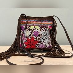 Rare Find, Very Cute Retro Style Floral Crochet Pattern, Beads & Leather Crossbody Bag By Streets Ahead. Made In Los Angeles, California, Of Italian Leather. Approximate Measurements: 8" X 9" X 1.5" Strap Adjusts From Approximately 47" To 53" (23.5" - 26.5") Outside Back Zip Pocket Inside Is Suede Lined With 1 Flat Pocket 7" Fringe Down Sides Of Bag Magnetic Closure I Did Confirm With Michelle Of Streets Ahead That This Is One Of Their Bags, Which Was Probably Made In 2011 - 2012. See Last Photo Brown Bohemian Crochet Bag For Festivals, Brown Crochet Festival Bag, Floral Crochet Pattern, Hippie Bags, Floral Crochet, Bead Leather, Magnetic Closure, Italian Leather, Leather Crossbody Bag