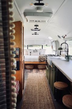 the interior of a camper van is clean and ready for people to use