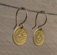 "Beautiful handmade gold Mandala flower discs swing from gold filled ear wires. ❉ F A C T S total length from top of ear wire: 1\" /2.5 cm disc: 0.5\"/ 1.3 cm diameter You will receive this Mandala Jewelry in a gift box, with an inspiring card, ready to be given as an empowering gift. Your earrings may vary slightly from the ones in the picture. Each pair is handmade to order. Feel free to contact me for any custom request : http://www.etsy.com/convo_new.php?to_username=ravitschwartz This design Gold Dangle Flower Earrings With French Hook, Adjustable Gold Round Flower Earrings, Handmade Gold Flower Earrings For Everyday, Gold Round Flower Earrings For Everyday, Gold Round Flower Earrings With Ear Wire, Mandala Jewelry, Mandala Earrings, Gold Disc Necklace, Mandala Necklace