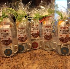 six packages of coffee are lined up on the counter