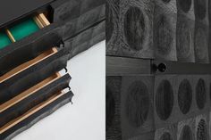 the drawers are made out of black wood and have green compartments in them for storage