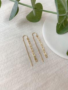 "PAPERCLIP CHAIN THREADER EARRINGS These gorgeous threaders are so lightweight, you'll forget you have them on, except when you're getting compliments! These dainty handmade earrings are minimal and modern. Not only are these earrings beautiful, but they are sensitive skin safe in 925 Sterling Silver or 14k Gold Filled. * Choose from 925 Sterling Silver or 14K Gold Filled * Approximately 2.25\" length * Made with all hypoallergenic and water safe materials 🤍 Shop more Threader Earrings here! ht Hypoallergenic Yellow Gold Threader Drop Earrings, Dainty Tarnish-resistant Linear Earrings For Gifts, Gold 14k Gold-filled Earrings, Brass Earrings With Adjustable Chain For Gift, Gold Hypoallergenic Threader Earrings For Everyday, Modern Gold Hypoallergenic Threader Earrings, Hypoallergenic Gold Long Drop Threader Earrings, 14k Gold Filled Earrings With Adjustable Chain For Gift, 14k Gold Filled Drop Earrings With Adjustable Chain