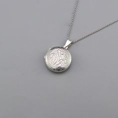 Round locket necklace silver chain,925 Sterling Silver Round Locket Necklace Chain, Silver Necklace, Unisex Silver Necklace CODE: PNK43 Metal: 925 Sterling Silver Locket size: 22mm W x 30mm H Chain Length: 16 Inch, 18 Inch   Chain Extension: 1.5 Inch Finishing: Silver Weight: 5.55 Gram Price Per Piece This beautiful 925 Sterling Round locket necklace silver chain would be a perfect gift for that special someone in your life Buy this necklace for your wife, daughter, sister, or best friend,  and know that without a doubt you have purchased the perfect present  for the any occasion, whether it is for mother's day,  valentines-day, Christmas, graduation or their birthday. It is designed to offer an artistic and lovely look.  This modern world requires something that makes you feel comfortable Silver Sterling Oval Charm Necklaces, Oval Silver Sterling Silver Charm Necklaces, Silver Oval Sterling Silver Charm Necklace, Classic Silver Engraved Necklace, Silver Engraved Pendant Charm Necklaces, Silver Sterling Silver Oval Pendant Charm Necklaces, Silver Oval Pendant Charm Necklace In Sterling Silver, Silver Sterling Silver Charm Necklace With Oval Pendant, Silver Engraved Pendant Charm Necklace