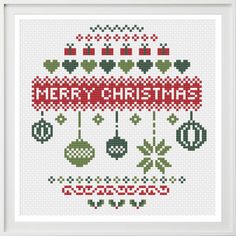 a cross stitch christmas ornament with ornaments