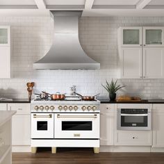 a stove top oven sitting inside of a kitchen next to an oven and countertop