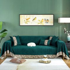 a living room with green walls and furniture