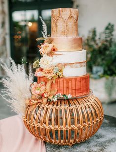 a three tiered cake sitting on top of a table