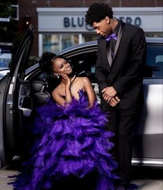 Purple Prom Dress Black Couple, Dark Purple Prom Dress Couple, Purple And Black Prom Couple, Dark Purple Prom Couple, Purple Prom Dress Couple, Prom Outfits Couples, Purple Prom Couple, Dark Purple Prom Dress, Ostrich Feather Skirt