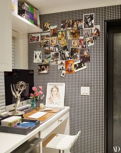 a home office with pictures on the wall