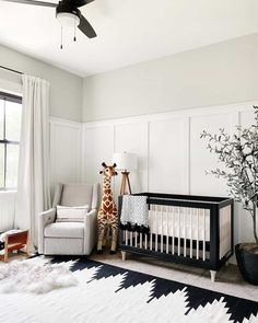 a baby's room with a black and white theme