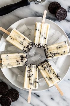 oreo pops are arranged on a white plate