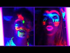 two people with their faces painted in neon colors