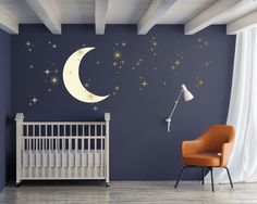 a baby's room with a crib and stars on the wall