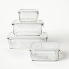 four glass casserole dishes stacked on top of each other