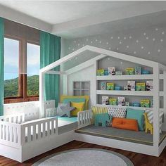 a child's bedroom decorated in white and blue