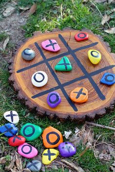 a tic - tac - toe board sitting in the grass