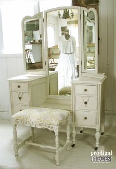 an antique vanity and dressing table in a room with white painted walls, flooring and furniture