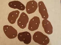 several pieces of chocolate covered cookies sitting on top of a table