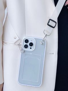 an iphone case is attached to a white belt with two black buttons on the back