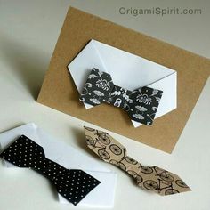 an origami bow tie and card on a table