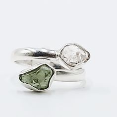 Divine Elegance Elevate your style with our exquisite Herkimer Diamond & Moldavite Ring, set in gleaming sterling silver. This stunning piece combines the celestial brilliance of Herkimer diamonds with the otherworldly energy of Moldavite, creating a ring that radiates elegance and power. Perfect for those who appreciate unique and spiritually significant jewelry, this ring is a true statement piece. Amplify Your Spiritual Journey Herkimer diamonds are renowned for their exceptional clarity and