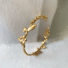 This dainty and intricate floral branch bracelet consists of a swirly branch like design loaded with lots of little forger-me-not flowers. It has two branches loaded with lots of lovely flowers growing out of each side. It has a tiny little pearl in the center of each flower.The metal base is flexible so it is very easy to adjust it to the wrist for a comfortable fit. * Comes wrapped in a beautiful gift package.* Could be requested in either 14k gold, rose gold or silver plated brass.For updates Cheap Yellow Flower Bracelet, Gold Flower Bracelet, Branch Bracelet, Bracelet Fil, Bohemian Bracelet, Gold Wrap, Floral Bracelet, Jewelry Bridesmaid, Bohemian Bracelets