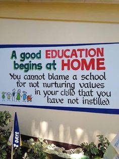 a sign on the side of a building that says, a good education begins at home you cannot blame a school for not nurturing value in your child that you have not installed