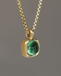 A juicy green emerald rounded square gem inside a solid 18k yellow gold bezel, hanging on a solid 14k yellow gold box chain. Sovereign Pendant by George Rings. Colombian Emeralds, Feel Special, Feeling Special, Box Chain, Emerald, Limited Edition, Gems, Pendant Necklace, Chain