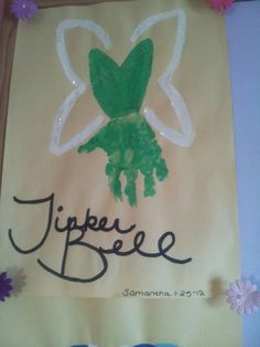 a paper bag with a handprint on it and flowers in the background that says jipeeee