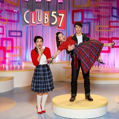 three people are posing for a photo on the set of tv show club 537