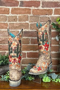 Cactus and Floral Embroidered Square Toe Boot by Corral Boots Beautiful, gorgeous, and cute. This colorful cactus and floral pattern against the taupe distressed colored leather are great for a wild west adventure.The cactus, the flowers, and the horseshoe multicolor contrast and complement beautifully through the taupe leather 13-inch shaft height. The gorgeous detailing will remind you of the desert. Wear them with jeans or dresses for a southwest look.You can wear this style all day without w Desert Wear, Colorful Cactus, Curvy Girl Dress, Corral Boots, Taupe Leather, Boot Straps, Fall Denim, Black Kids Hairstyles, Heel Caps