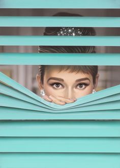 a woman peeking out from behind the blinds