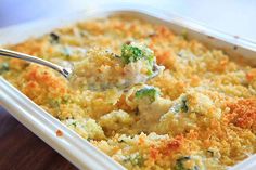 broccoli and cheese casserole with a spoon in it