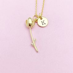 This is gold tone tulip charm with hand stamped initial charm on brass or stainless-steel chain. ♥ You will receive ONE necklace. HOW TO ORDER 1) Choose the quantity. 2) Choose the initial in the option or add a note to seller at checkout. 3) Add to the cart. DESCRIPTION ♥ Necklace, Stainless Steel Chain with Lobster Claw Clasp, Size: about 17.7 inches (45cm) long, 1-2mm wide, Nickel Safe, *stainless steel is durable, highly resistant to rust and corrosion. OR ♥ Necklace, Real 18K Gold Plated Br Personalized Gold Flower Shaped Charm Necklaces, Gold Charm Necklace With Flower Pendant For Personalized Gift, Personalized Gold Charm Necklace With Flower Shape, Personalized Gold Flower-shaped Charm Necklace, Personalized Gold Flower Charm Necklace, Gold Birth Flower Charm Necklace For Valentine's Day, Personalized Gold Jewelry With Flower Charm, Valentine's Day Gold Birth Flower Charm Necklace, Gold Flower Charm Necklaces For Valentine's Day