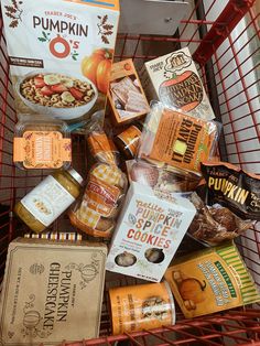 a shopping cart filled with lots of different types of food and snacks in it's basket