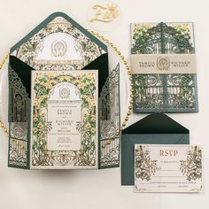 an elaborately designed wedding suite with matching stationery is displayed on a white surface