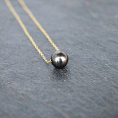 "\"Medium\" 9-10 mm Tahitian pearl floater. Pearl measures approximately 9-10 mm in size and are oval/teardrop in shape. On your choice of gold fill or sterling silver chain. This chain will not tarnish and can even get wet! These pearls are not flawless and may have a dimple or a ring in the surface. However, they are very pretty and lustrous and make for a gorgeous necklace!" Tahitian Pearl Necklace For Wedding, Tahitian Pearl Drop Necklace For Wedding, Floating Pearl Necklace, Pearl Bangle Bracelet, Pearl Bangle, Wedding Jewellery Necklace, Tahitian Pearls, Gift Handmade, Gorgeous Necklaces