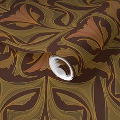 an artistic wallpaper design with swirls and leaves in brown, gold and white