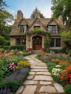 a stone path leads to a house with flowers in the front yard and landscaping around it